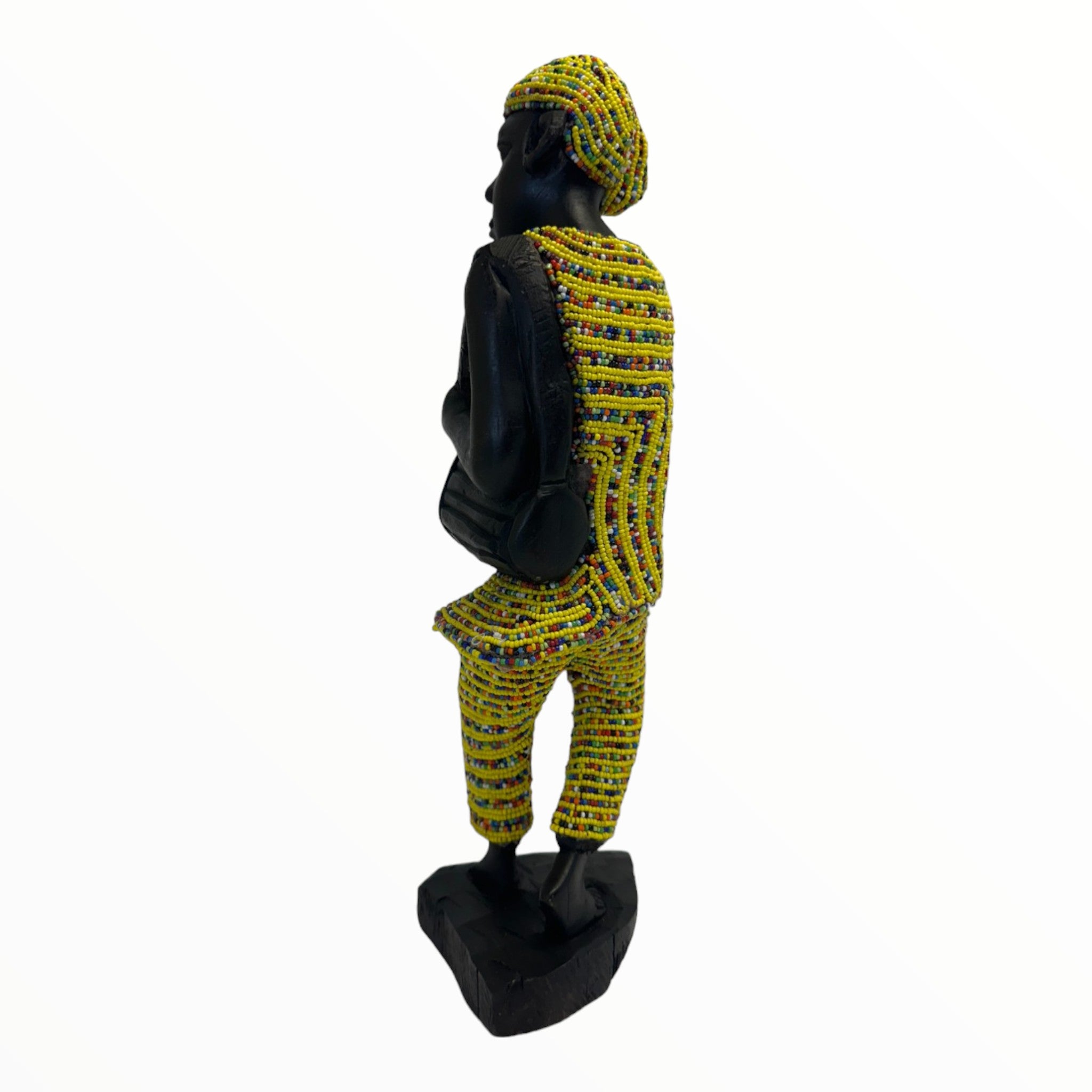 A male drummer sculpture in a Yellow attire