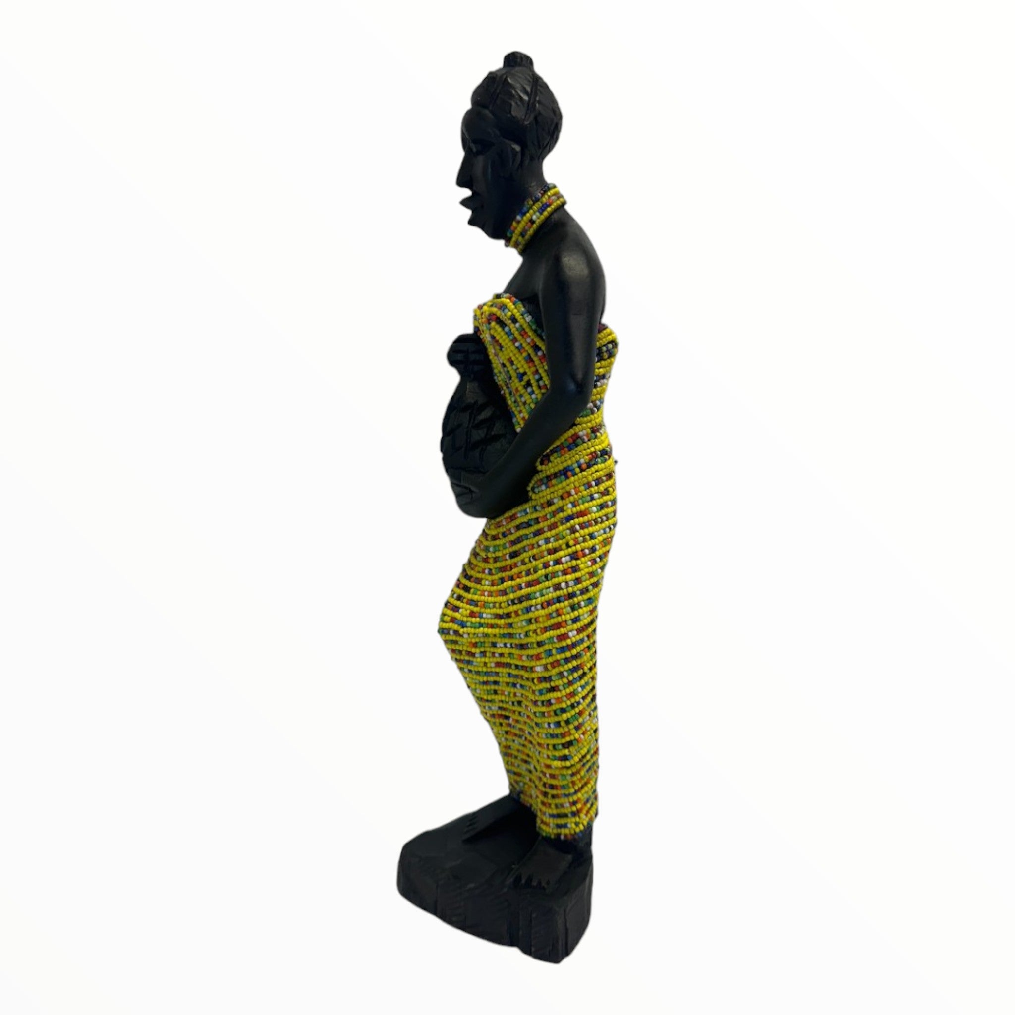 Sculpture of a woman carrying a pot in a yellow attire