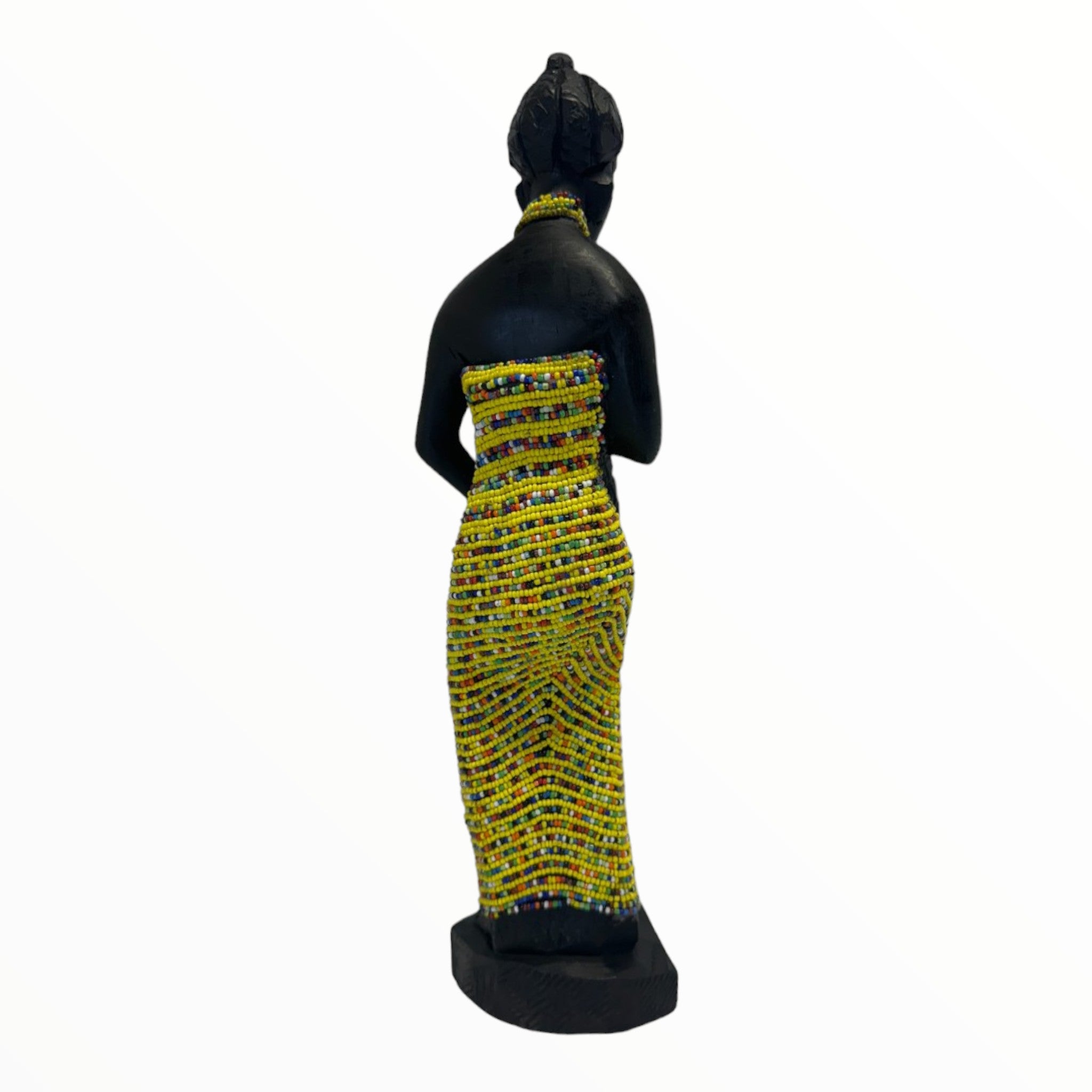 A female sculpture in a yellow attire