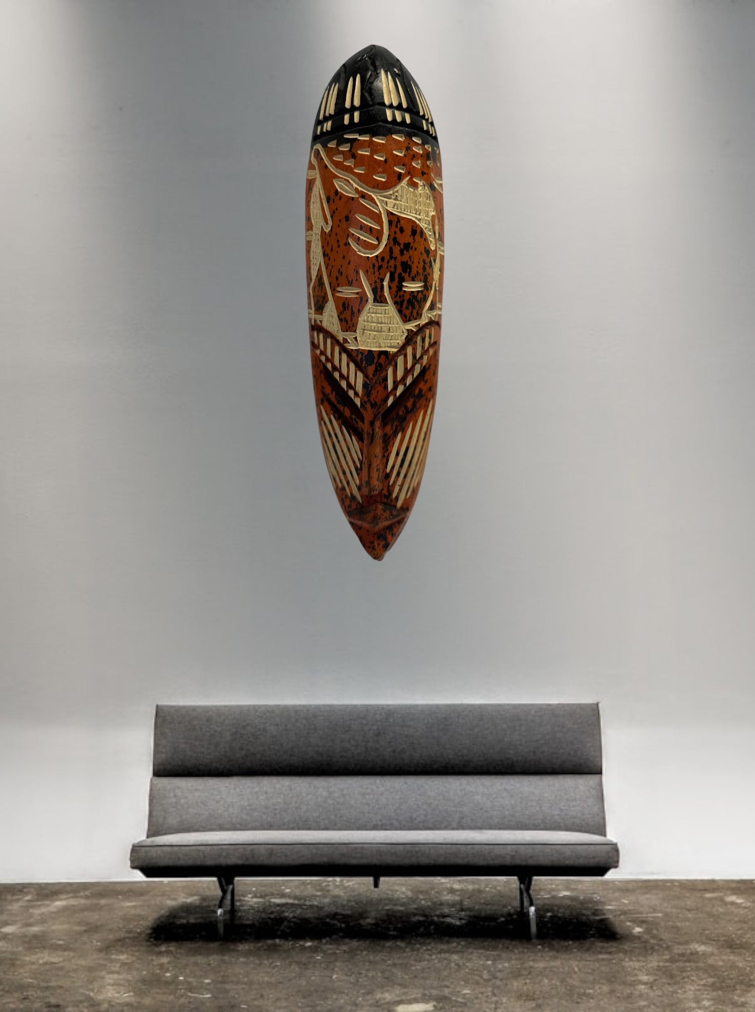 An Orange African Wall Art hung on the wall in a House